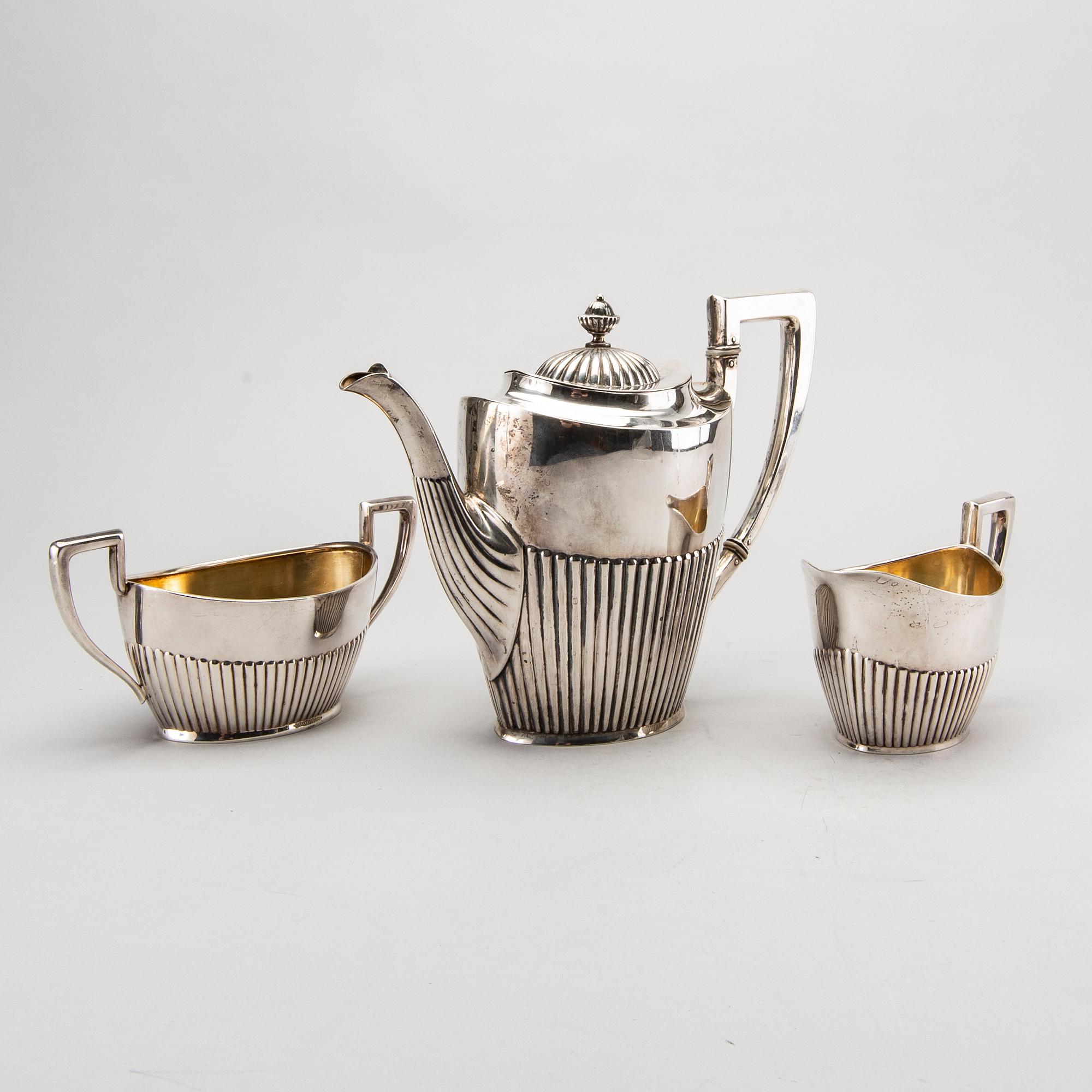 A three piece silver coffee service mark of CG Hallberg Stockholm 1916, weight 896 gram.