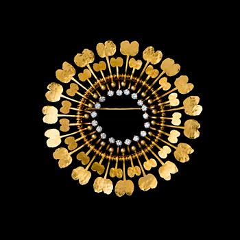 TAPIO WIRKKALA, BROSCH Diamantsol. 18K guld,  diamanter totalt 0,78 ct. N. Westerback, 1972.