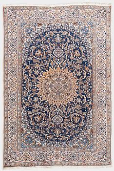 A carpet, Nain, part silk, ca. 295 x 201 cm.
