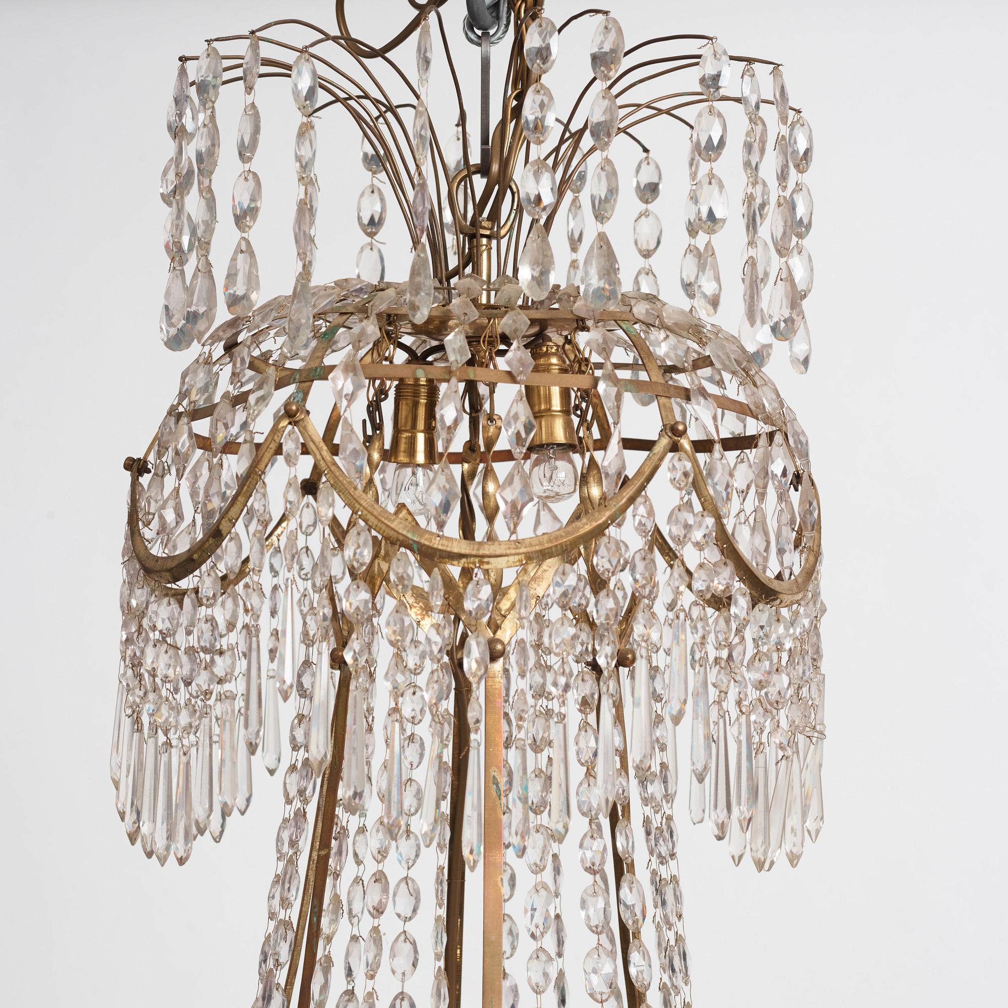 A late Gustavian gilt brass and cut glass seven-light chandelier, Stockholm, late 18th century.