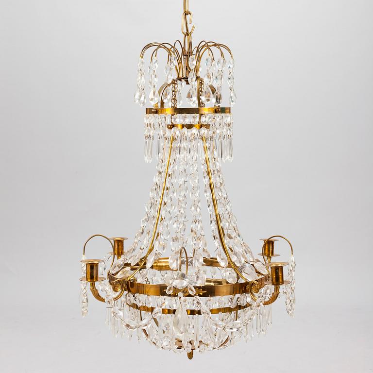 A Gustavian style chandelier from the first half of the 20th century. Height 67 cm.