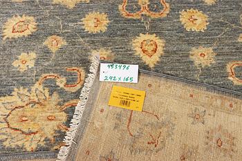 An Ushak rug, c. 242 x 165 cm.
