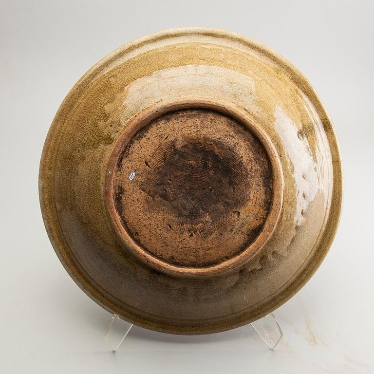 A celadon ge glazed dish, South East Asia, presumably Sawankhalok, 15th/17th Centuyr.