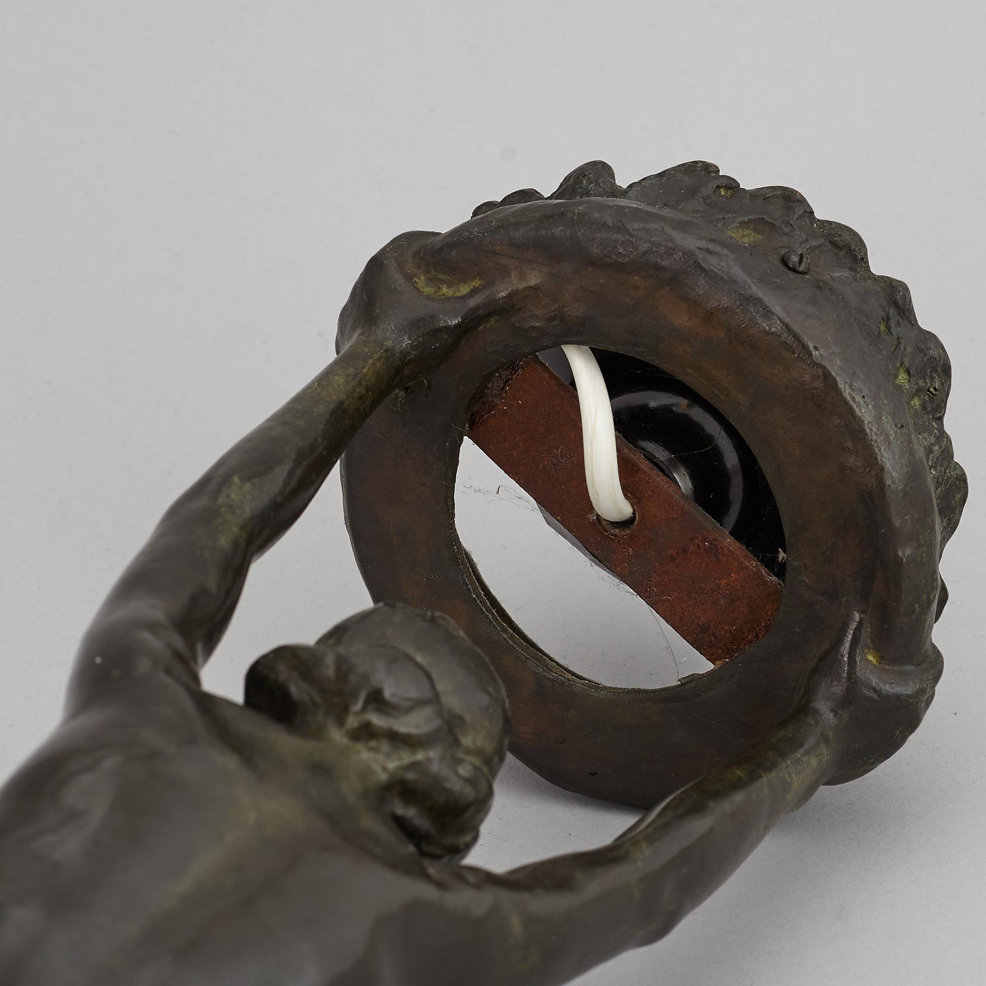 GERDA SPRINCHORN, an Art Nouveau green patinated bronze lamp "The Sun", Herman Bergman, Stockholm, early 20th century.