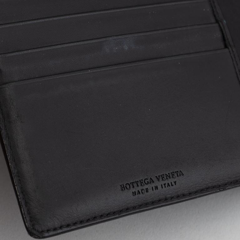 Bottega veneta, a black leather wallet.