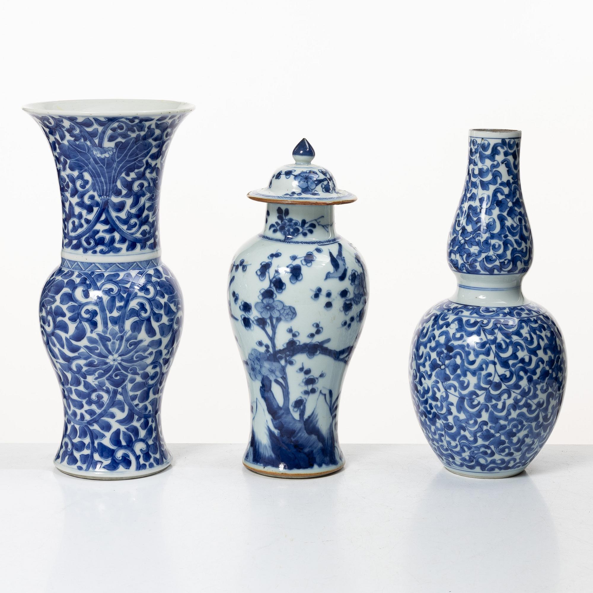 Two blue and white vases, Qing dynasty, 19th century and a blue and white vase with cover, 18th century.