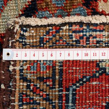 An antique Heriz carpet of karadja design, Northwest Persia (Iran), c. 338 x 239 cm.
