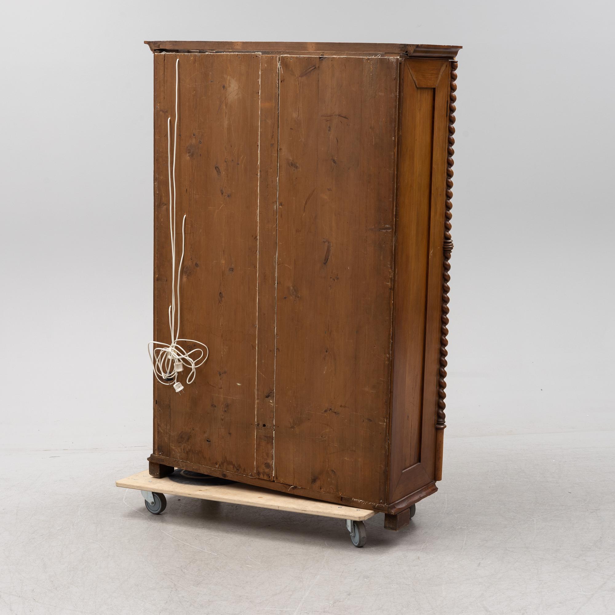 A mahogany veneered Gothic Revival cabinet, second half of the 19th Century.