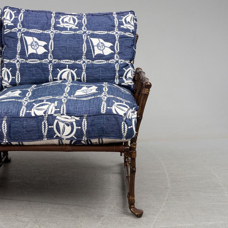 A contemporary bamboo imitating garden sofa.