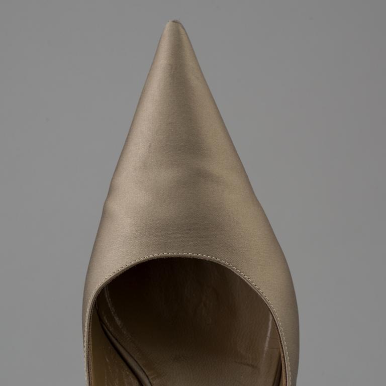 Green silk slingbacks by Sergio Rossi.