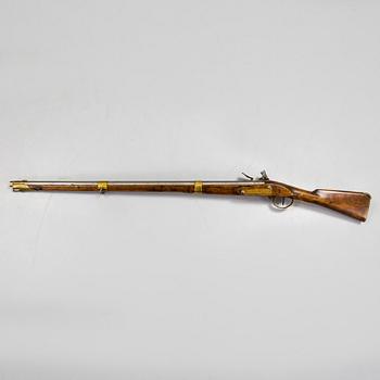 A late 18th century flintlock rifle.