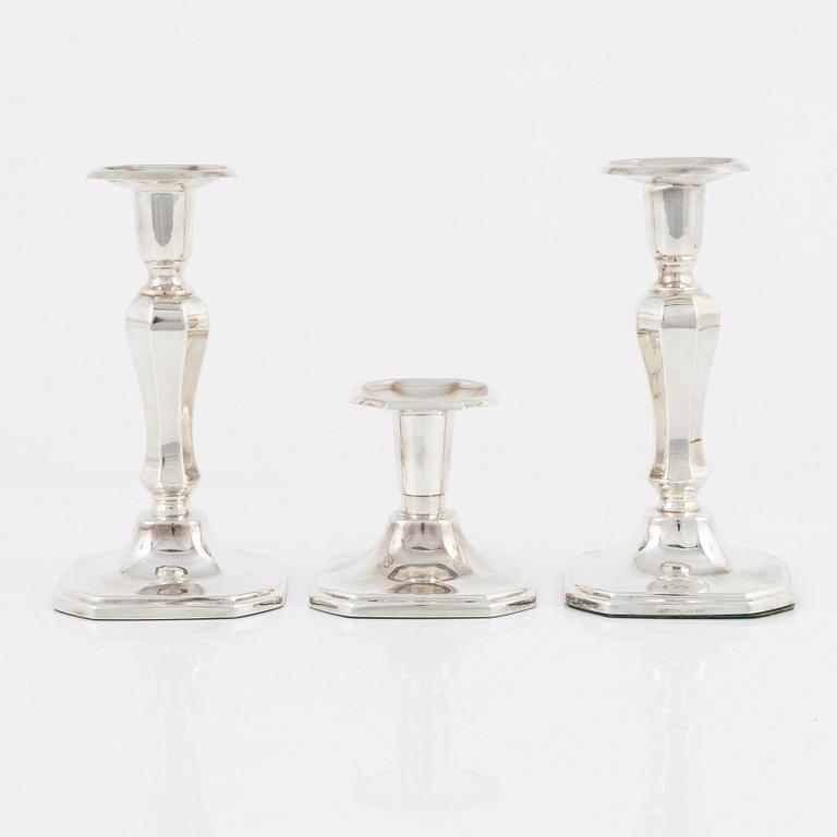 A pair of silver candlesticks, MGAB, Uppsala, 1985 and a silver candlestick, MEMA, Lidköping, 1987.