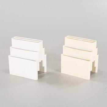 A pair of magazine racks, designed by Giotto Stoppino  for Kartell.