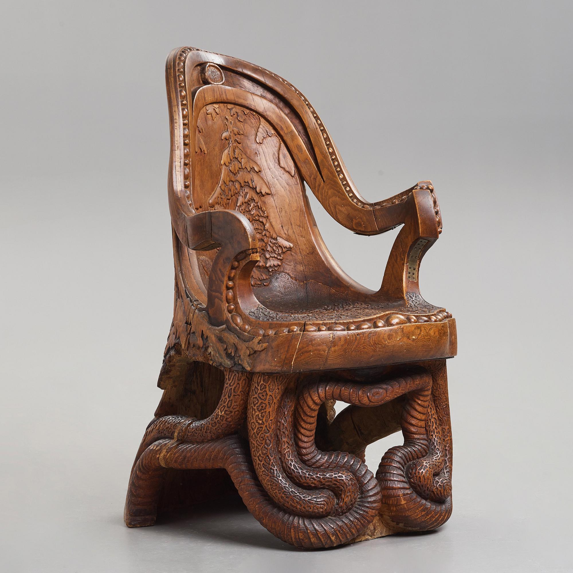 Knut Fjaestad, an Art Nouveau sculptured and carved pine throne, Sweden early 20th century.