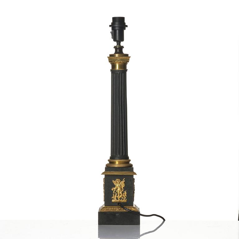 A French Empire ormolu and tole lamp, early 19th century.