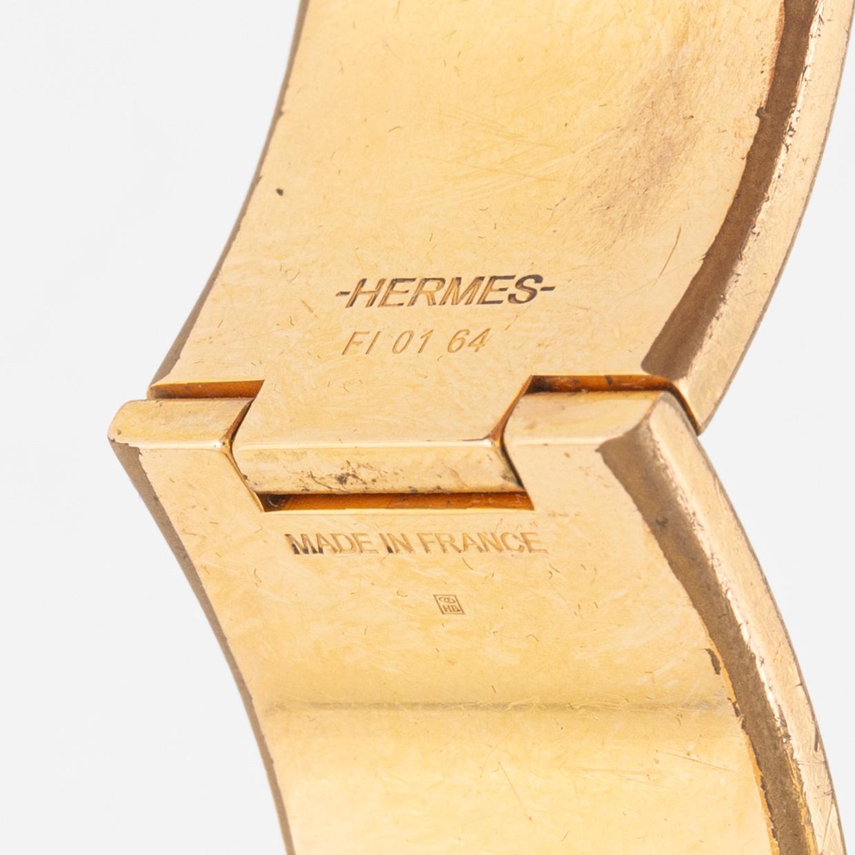 Hermès, a 'Clic Clac H' bracelet.