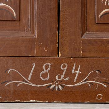 A cabinet, dated 1824.