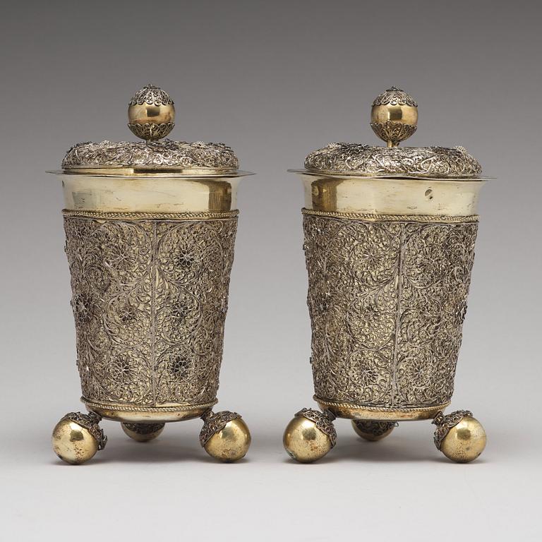 A pair of Swedish 17th century filigree and parcel-gilt silver beakers and covers, mark Rudolf Wittkopf, Stockholm 1698.