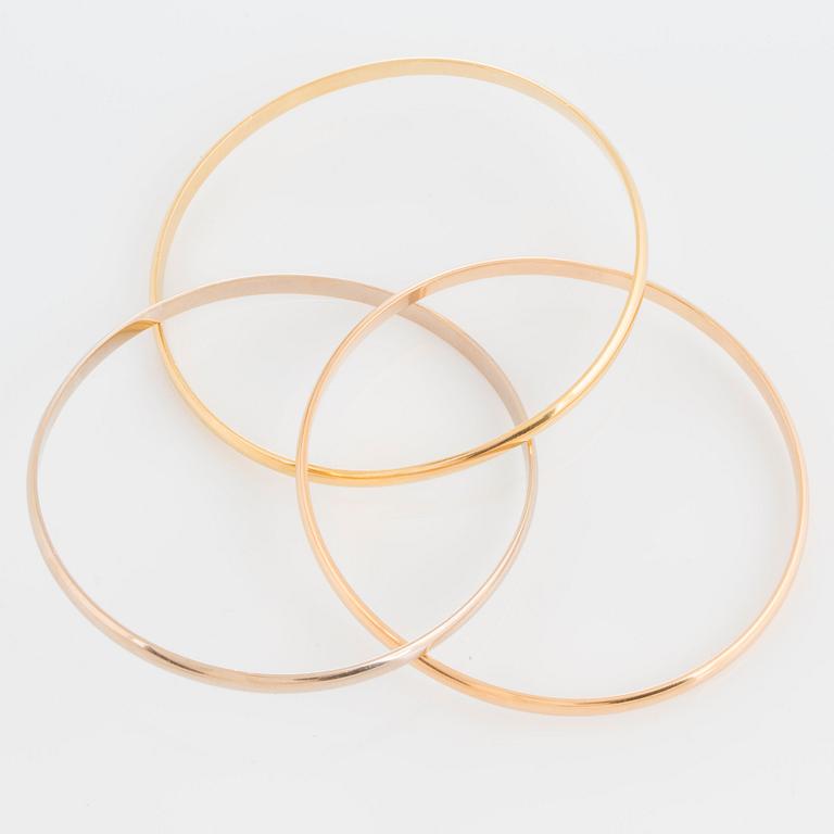 A Cartier "Trinity" bangle.