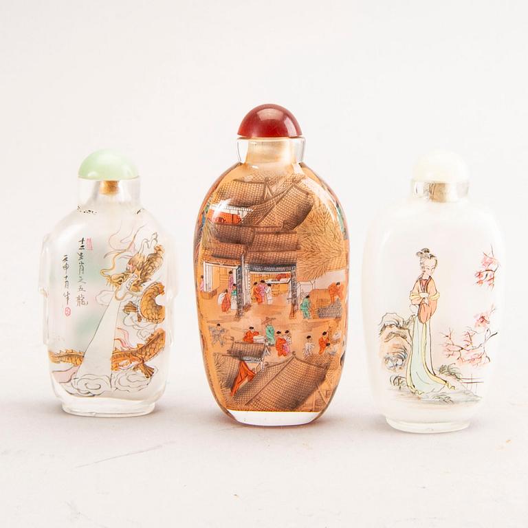 A set of seven different metal and glass snuff bottles 20th century.