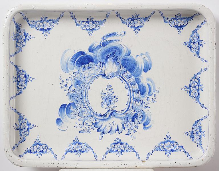 A rococo faience-top tea table, Rörstrand 1765.