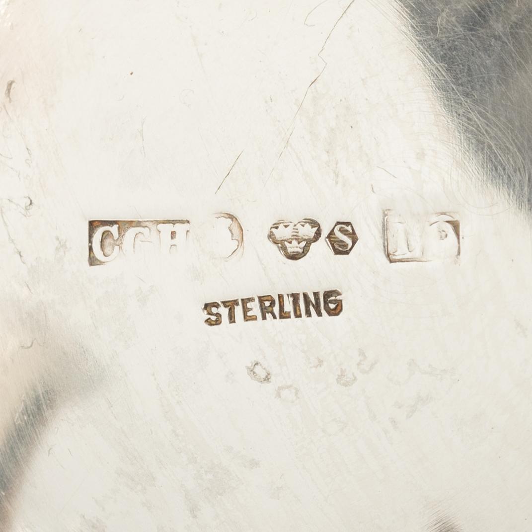 Two silver beakers and a bowl,