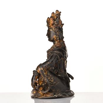 A cold gilt bronze figure of Avalokitshvara, Ming dynasty.
