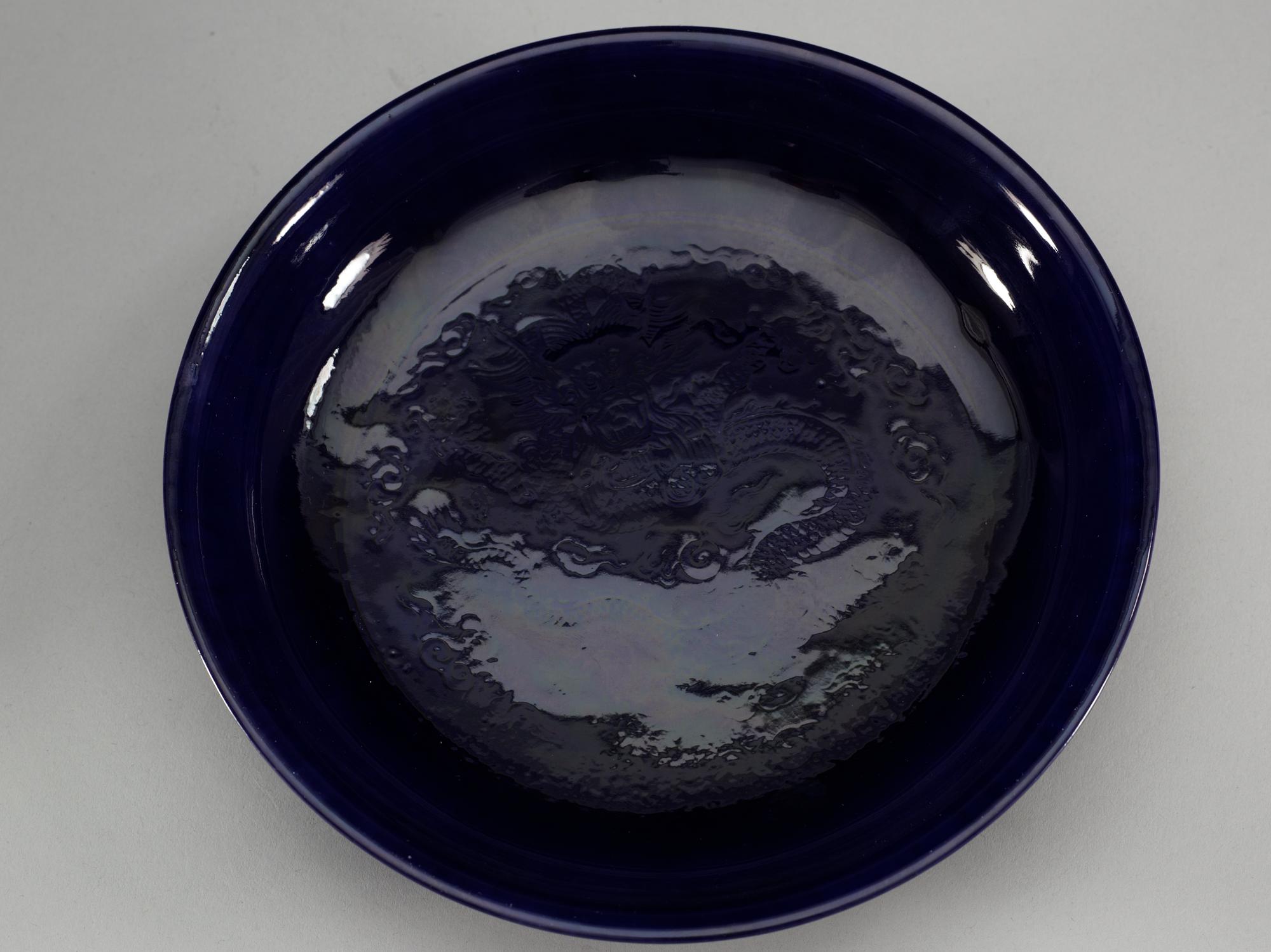 A pair of deep purple glazed dishes, Qing dynasty, with Qianlong six character mark.
