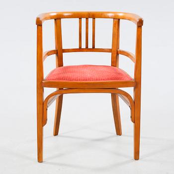 A table and a arm chair from the second quarter of the 20th century.