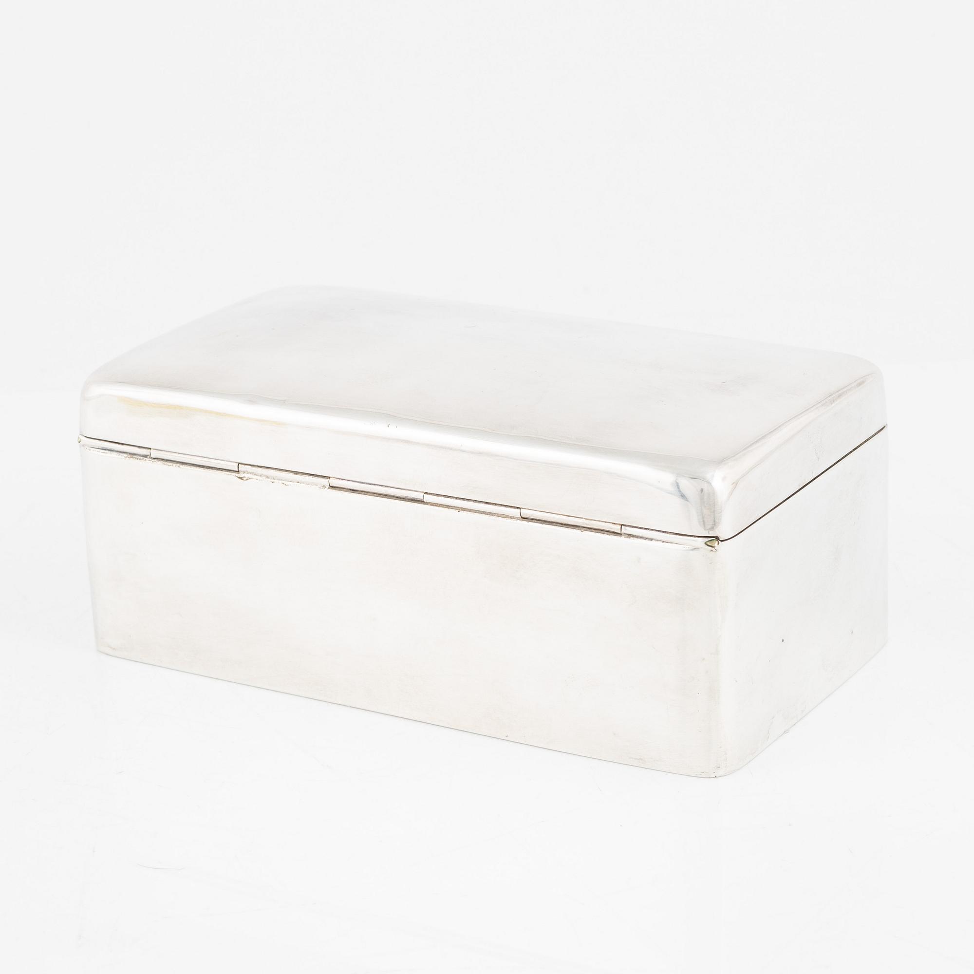 A silver cigarette box, Walker & Hall, Birmingham, England, 1919.