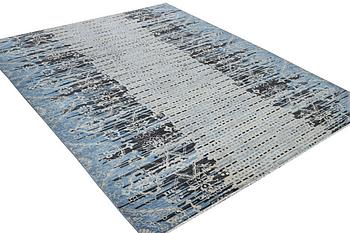 An oriental carpet, c. 302 x 244 cm.