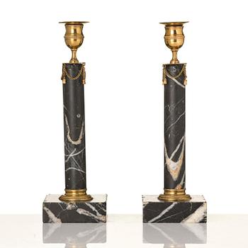 A pair of Gustavian black marble candlesticks.