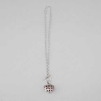 A Christian Dior costume jewelry pendant.