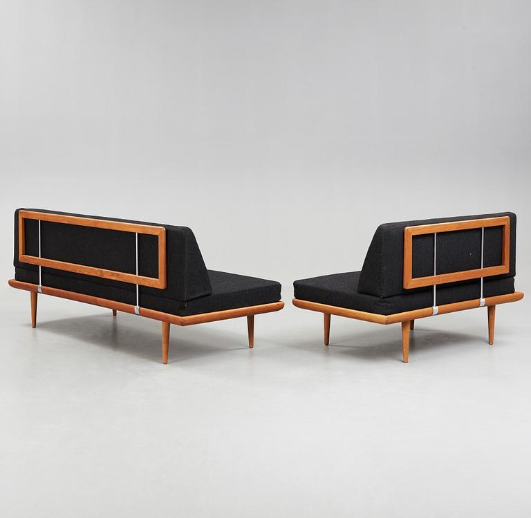 A set of two Danish 'Minerva' sofas with a table for France & Daverkosen.