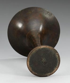 A trumpet shaped 'Archaistic' bronze vessel, Qing dynasty, 18th Century, with seal mark to base.