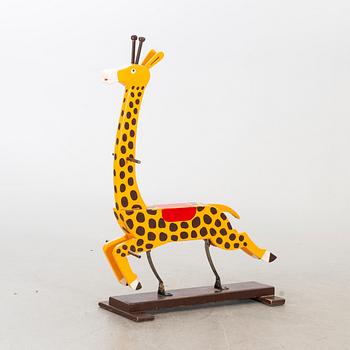 A second half of the 20th century rocking giraffe.