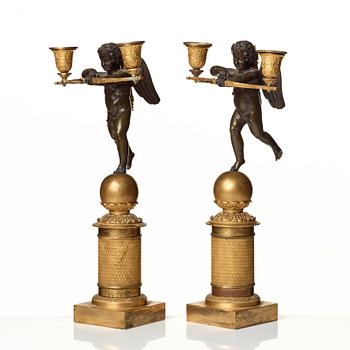 A pair of French Empire two-light candelabra.