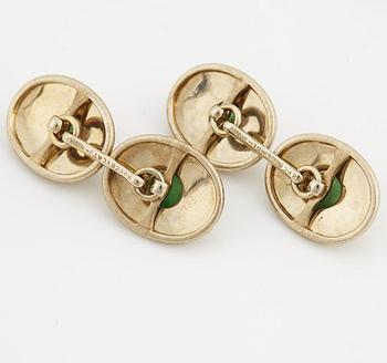 A pair of jade cufflinks and studs from Buccellati.