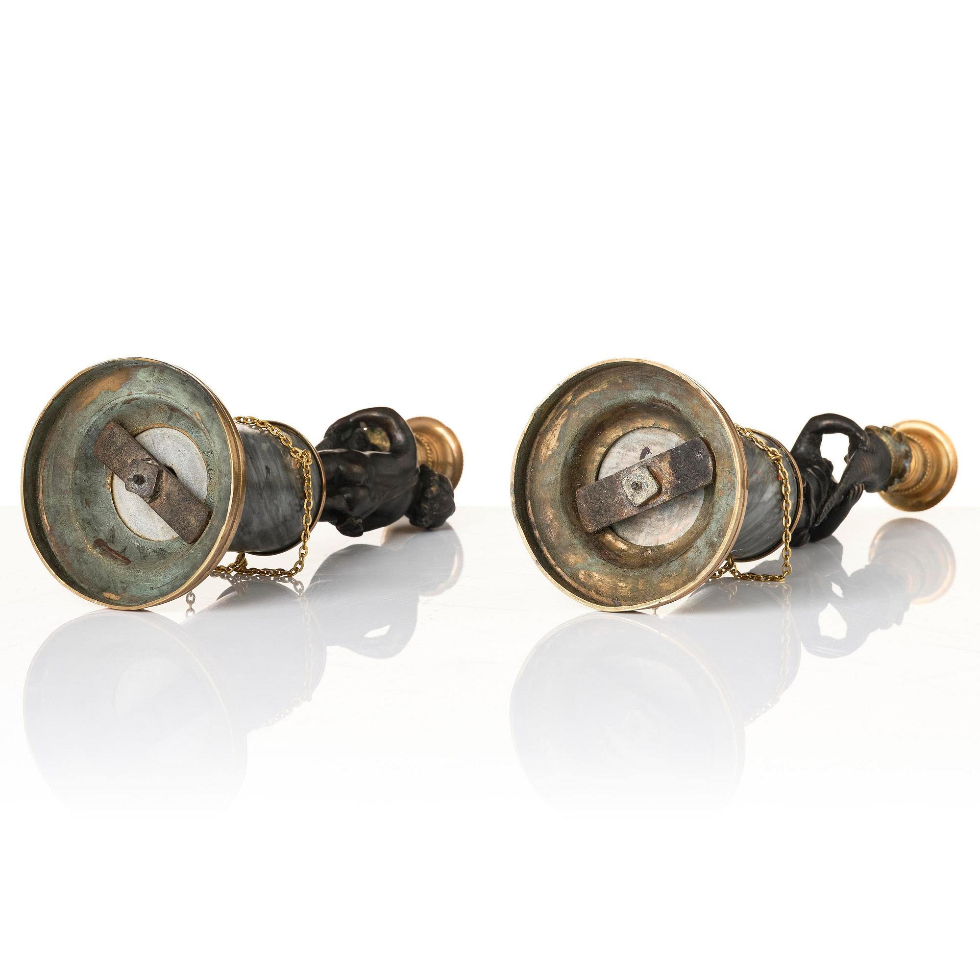 A pair of French Louis XVI ormolu and marble candlesticks, late 18th century.