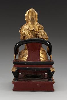 A wooden gilt lacquer figure of a warrior diety, Qing dynasty, 18/19th Century.