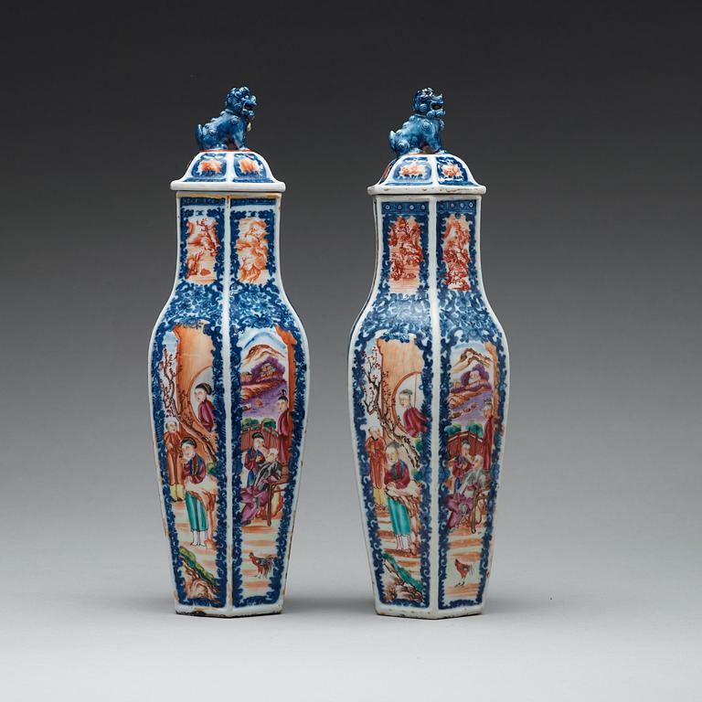 A pair of famille rose and underglaze blue vases with covers, Qing dynasty, Qianlong (1736-95).