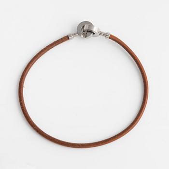 Hermès, a leather and palladium choker necklace.