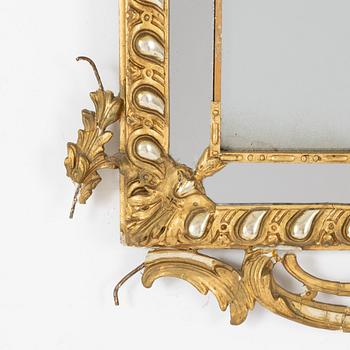 A Rococo revival mirror and a console table, second half of the 19th Century.