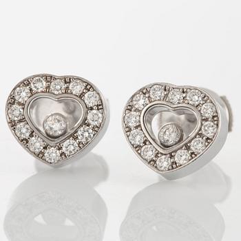 A pair of Chopard "Happy diamonds" earrings in 18K white gold with round brilliant-cut diamonds.