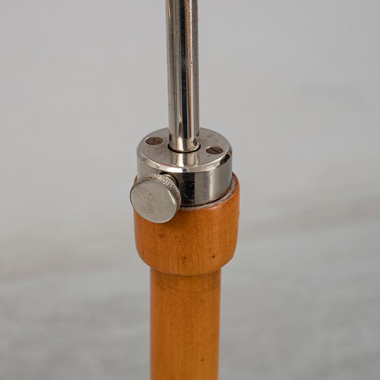 A 1940s birch wood floor lamp.