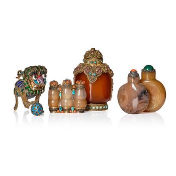 A set of four Chinese snuff bottles and a sculpture, 20th Century.