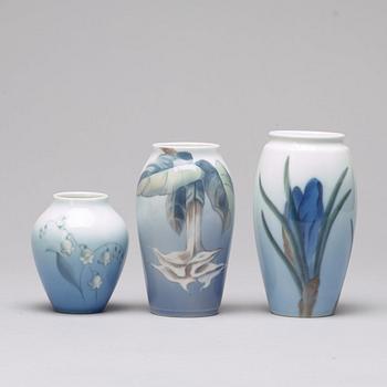 BING & GRÖNDAHL and ROYAL COPENHAGEN, a set of three porcelain vases and a dish, Denmark.