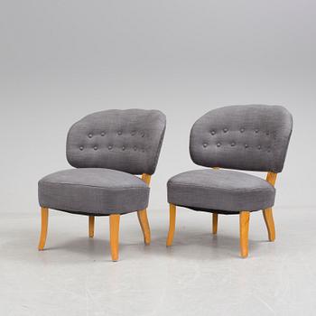 A pair of "Gamla Berlin" easy chairs by Carl Malmsten.