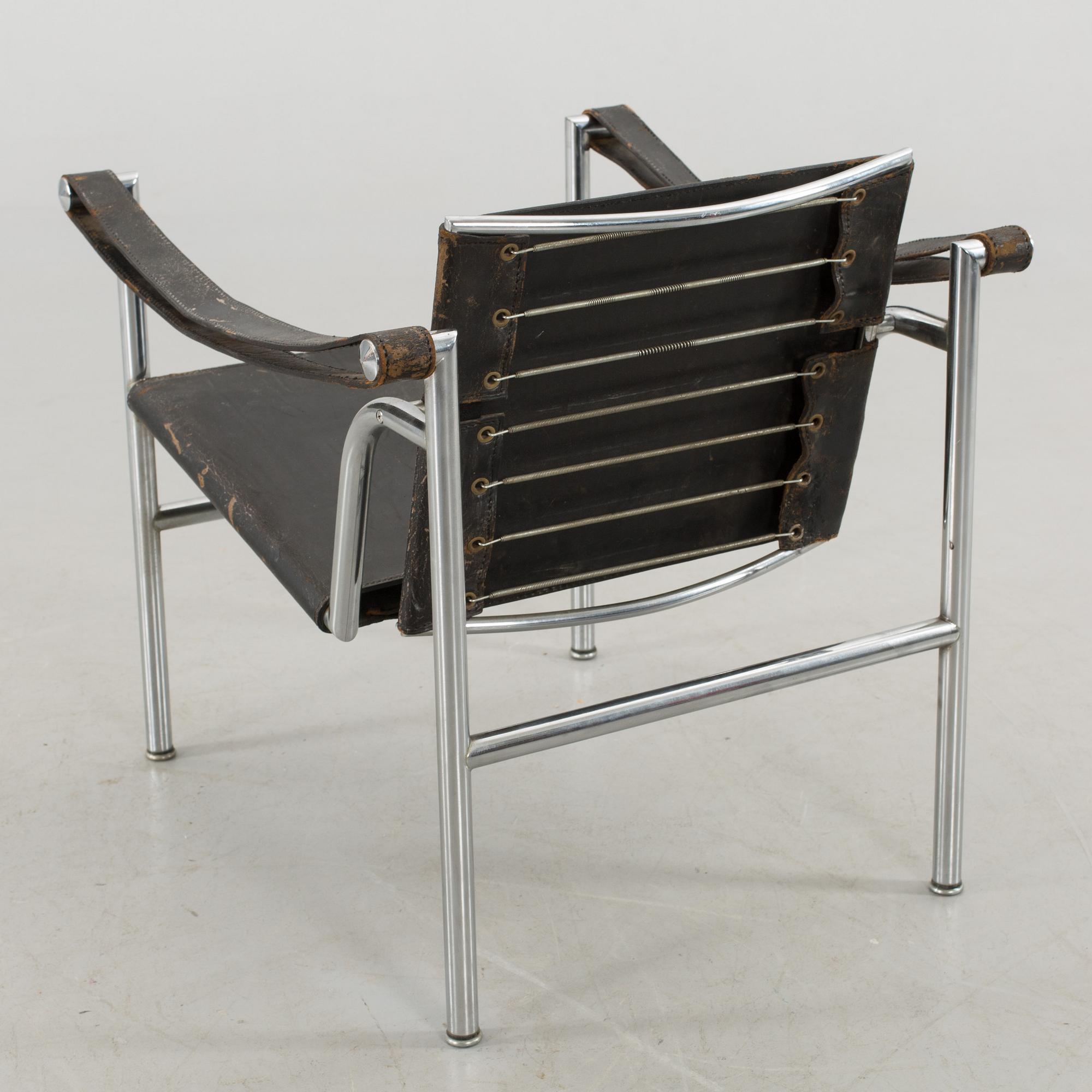 A "LC-1" ARMCHAIR DESIGNED BY LE CORBUSIER FOR CASSINA.