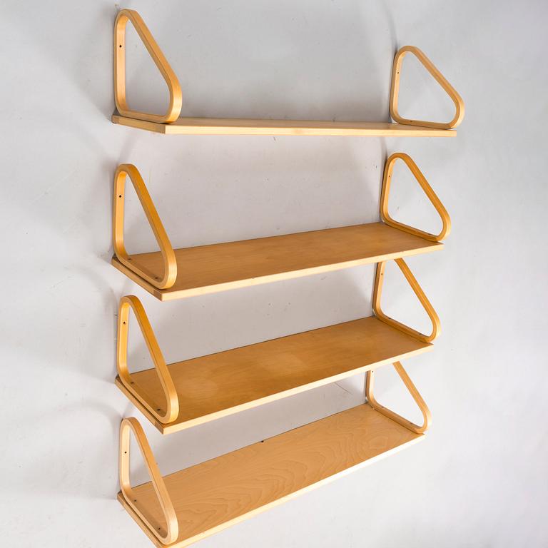 ALVAR AALTO, a set of four '112B' shelves for Artek, latter half of the 20th century.